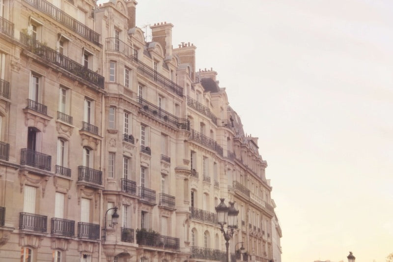 Golden Haussmann buildings along the seine river in Paris. Afternoon sunset pastels 