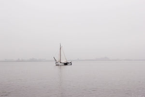 sailboat on the Gouwzee lake in the netherlands spring morning mist grey wall art photography